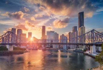 Brisbane Skyline With Story Bridge At Sunset, Showcasing The City’s Architecture — Metwide Communications in Brisbane, QLD