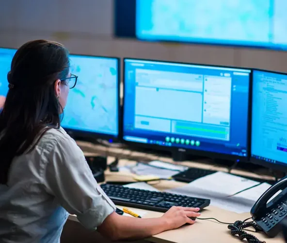 Woman Remotely Monitoring Commercial Security Solutions — Metwide Communications in Gold Coast, QLD